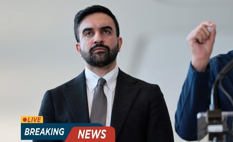 Man in suit and tie standing at a podium with a 'Breaking News' graphic overlay