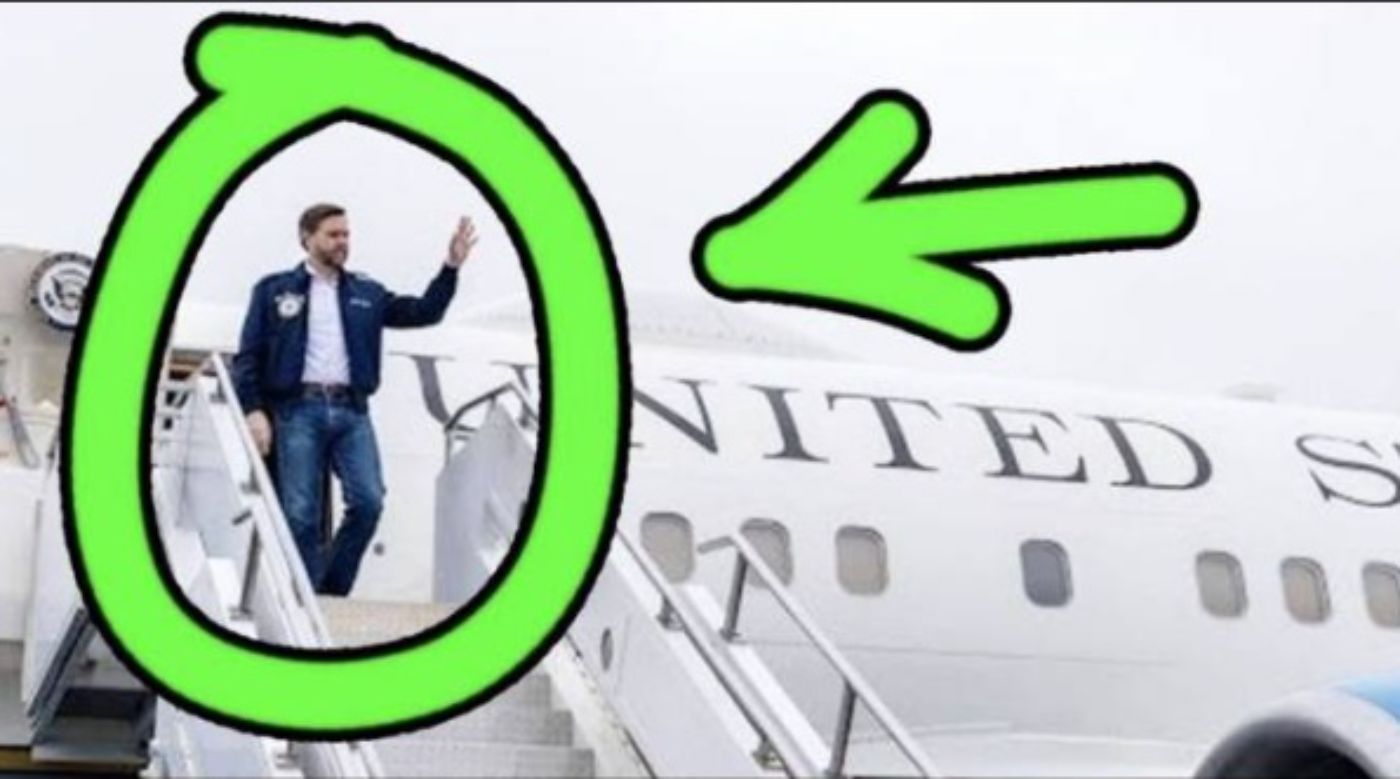Vance waves while boarding a United States aircraft