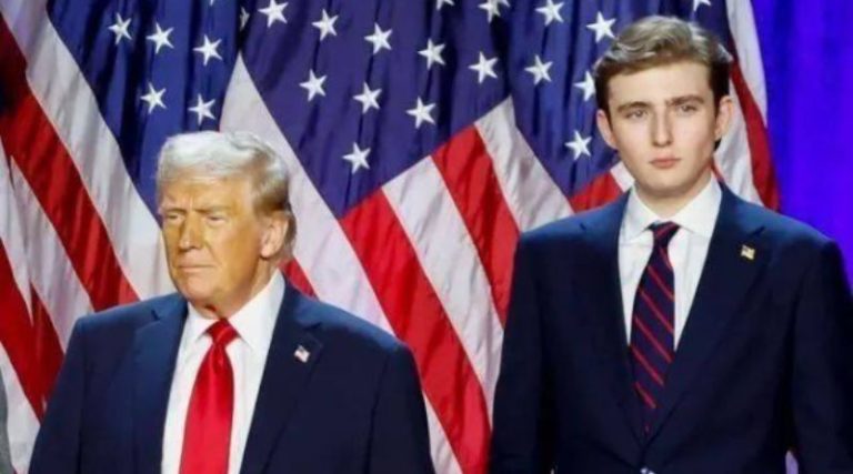 Donald Trump and Barron Trump on stage with flags
