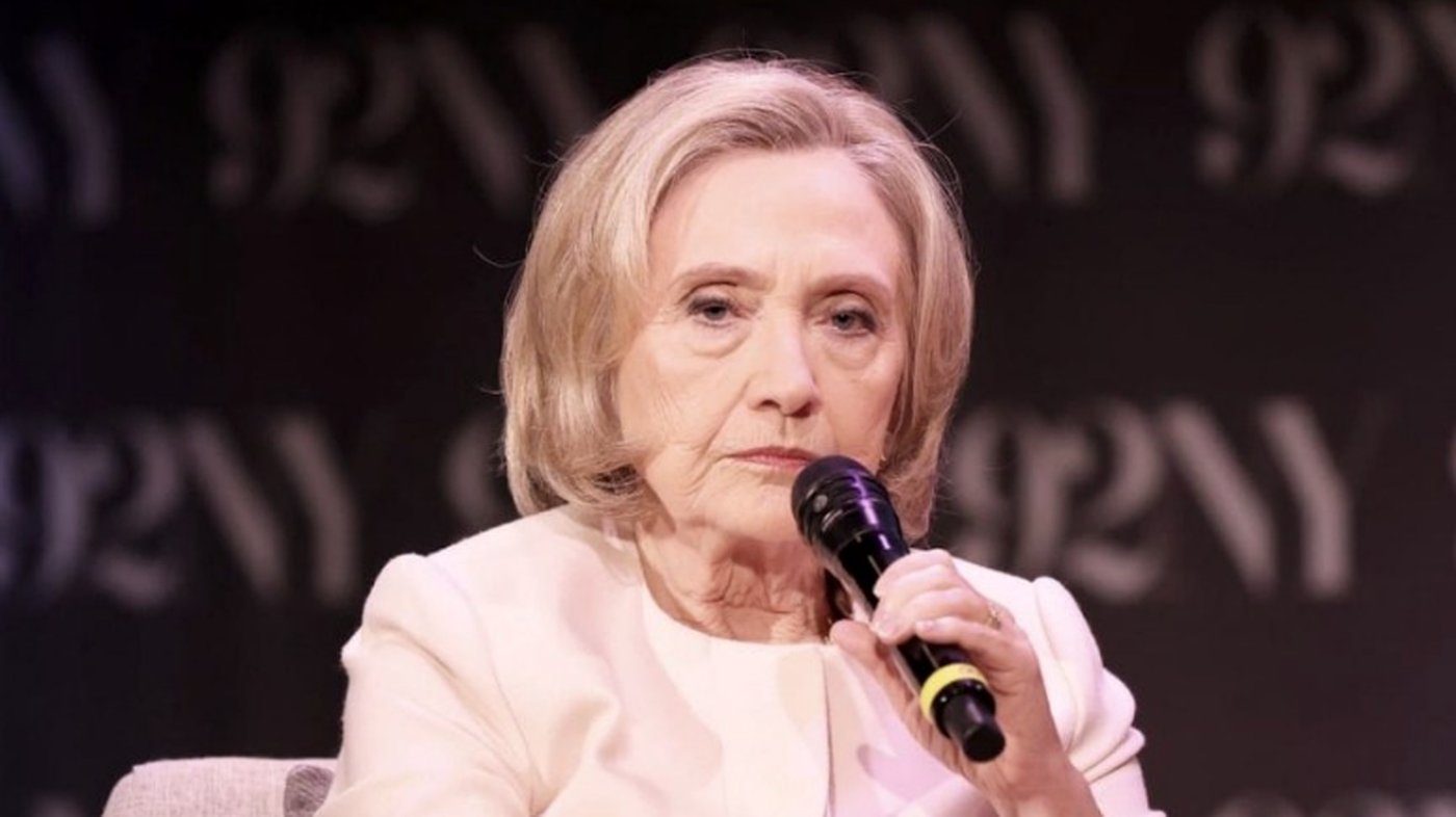 Hillary Clinton speaking into a microphone