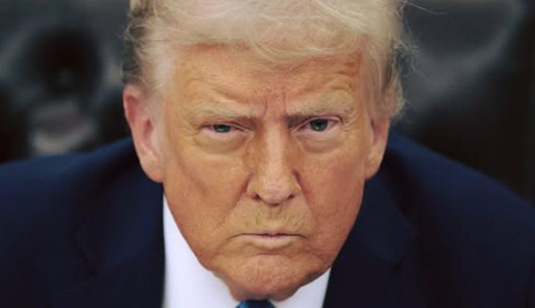 close-up portrait of Donald Trump wearing dark navy suit and white collared shirt with