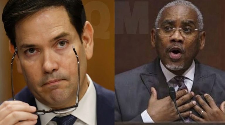senator Marco Rubio holds eyeglasses while Congressman Gregory Meeks speaks passionately
