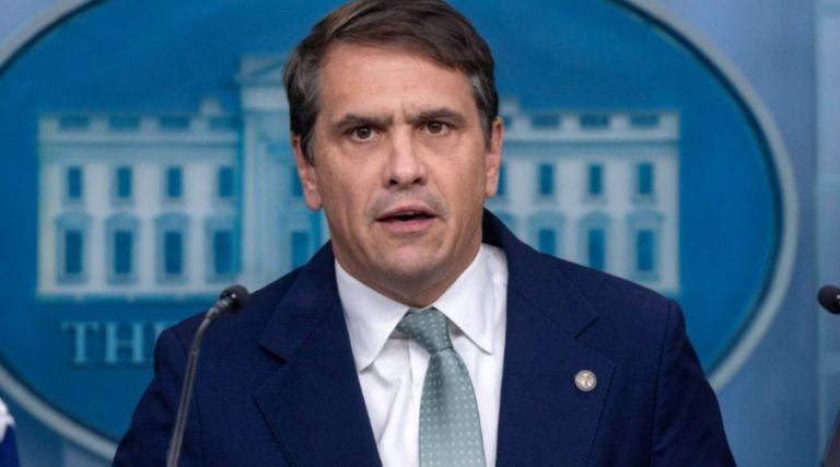 press briefing with serious speaker at White House podium
