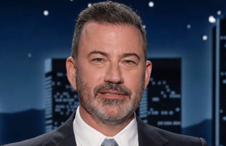 jimmy Kimmel smiling on stage during late-night show taping
