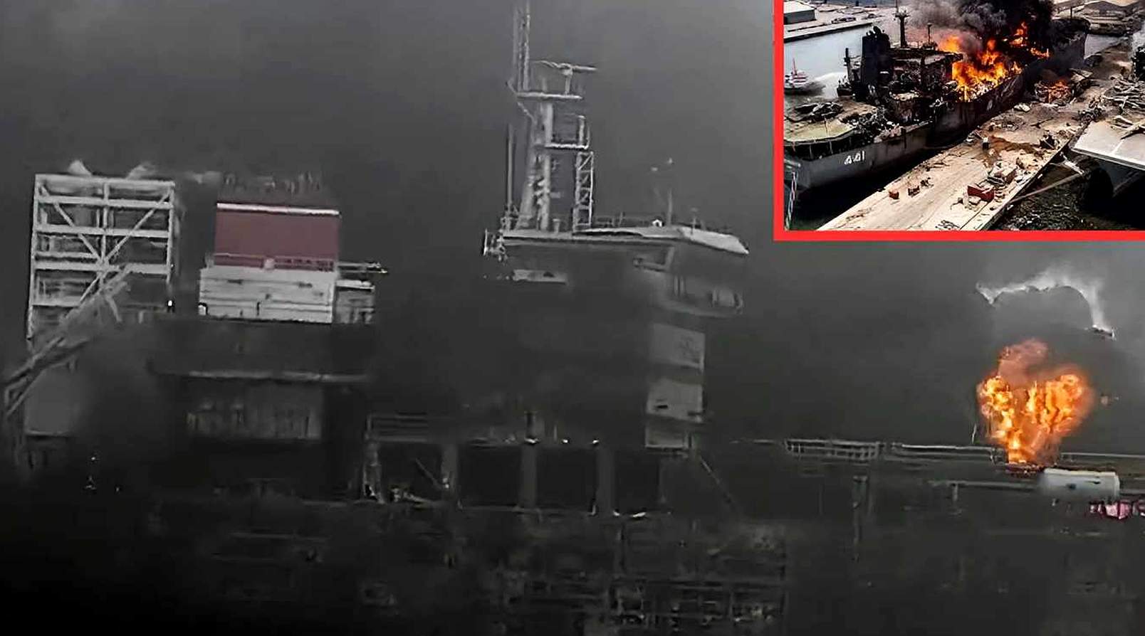 burning naval vessel marked 461 engulfed in flames at dockyard with thick black smoke