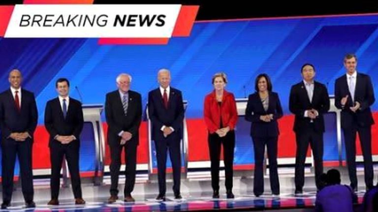 democratic candidates on stage during a debate event