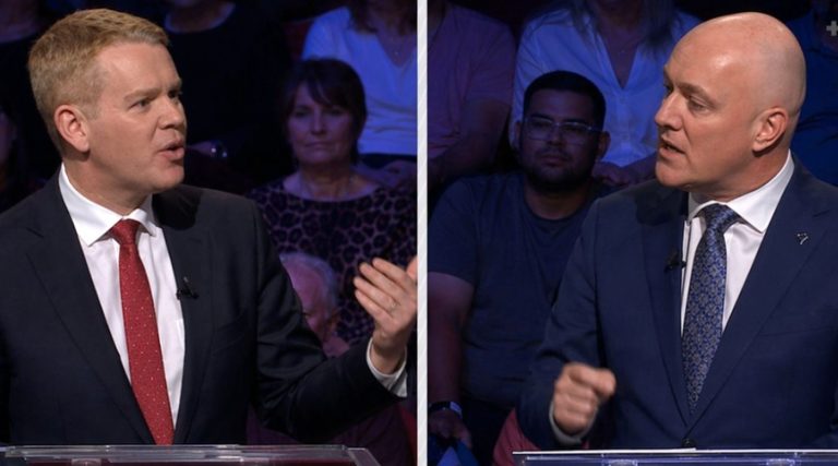 split-screen debate shows Chris Hipkins gesturing while Christopher Luxon makes a point