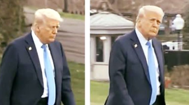 donald Trump in dark suit and light blue tie walking outdoors near White House entrance