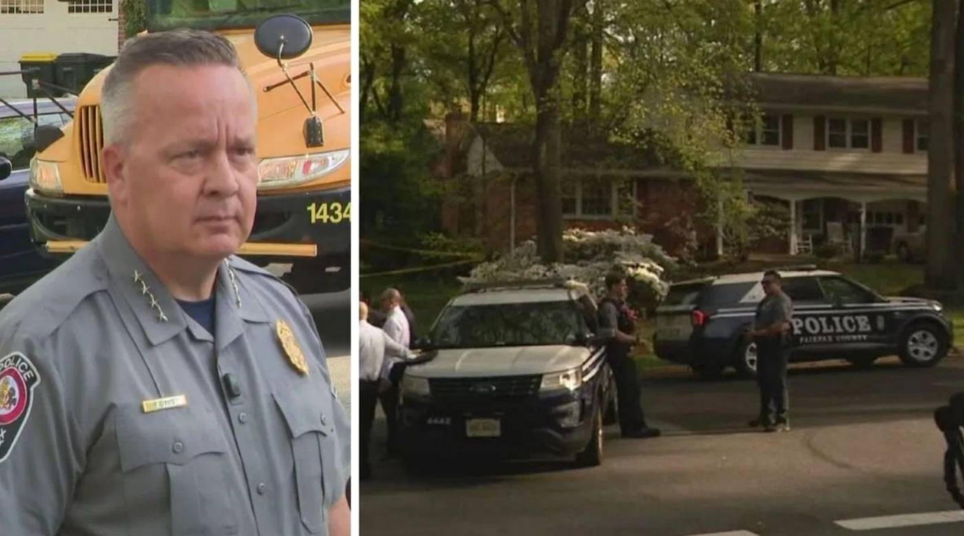 fairfax County Police Chief Kevin Davis stands before a school bus while officers