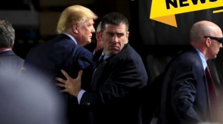 trump escorted by security amidst a chaotic event