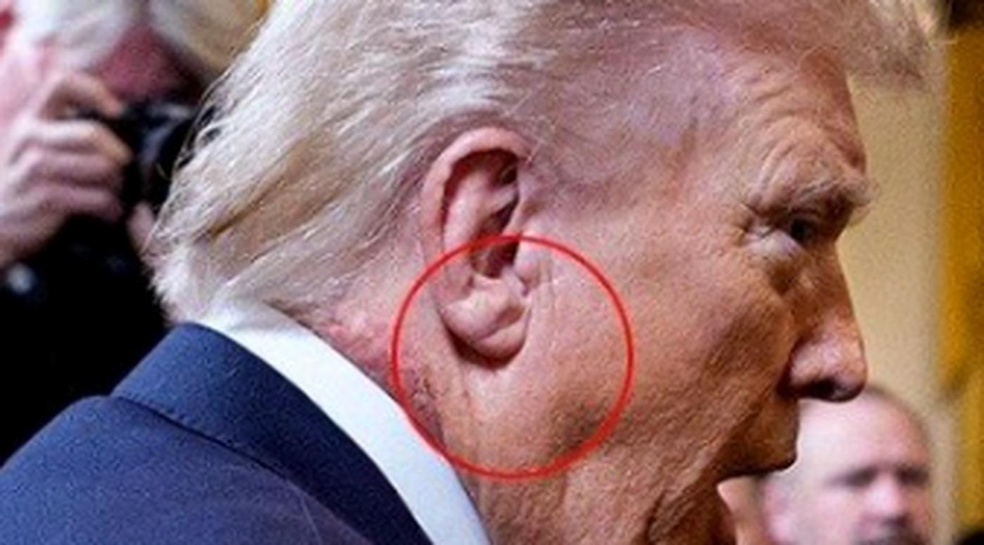 close-up of a man with distinctive hairstyle and ear detail