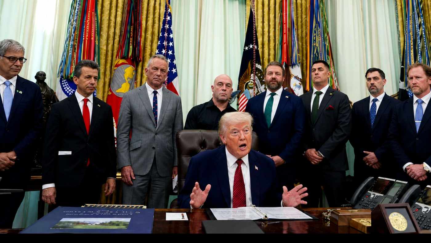 Donald Trump signs an executive order with Joe Rogan.