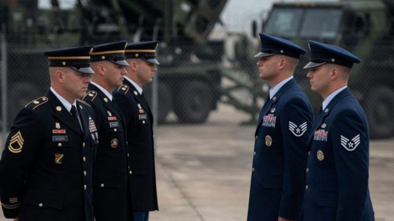 soldiers and airmen in uniform facing each other during ceremony
