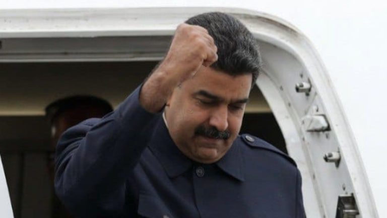 venezuelan leader raises fist in defiance at airport