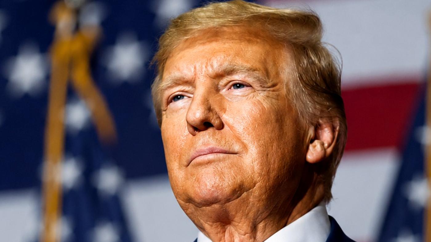 Donald Trump serious portrait with flags
