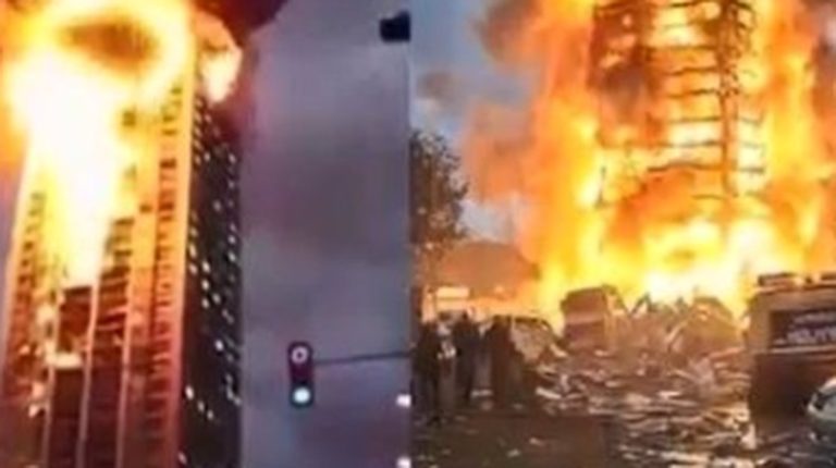 High-rise buildings engulfed in massive flames
