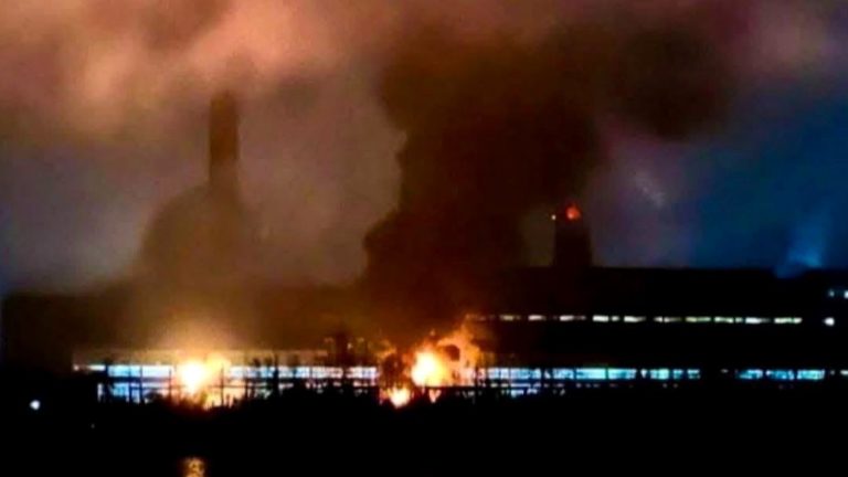 Massive industrial factory fire at night
