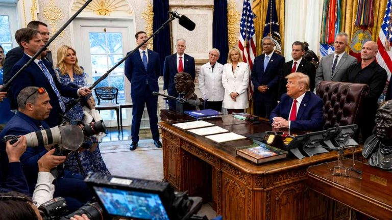 Donald Trump at the Resolute Desk in Oval Office.