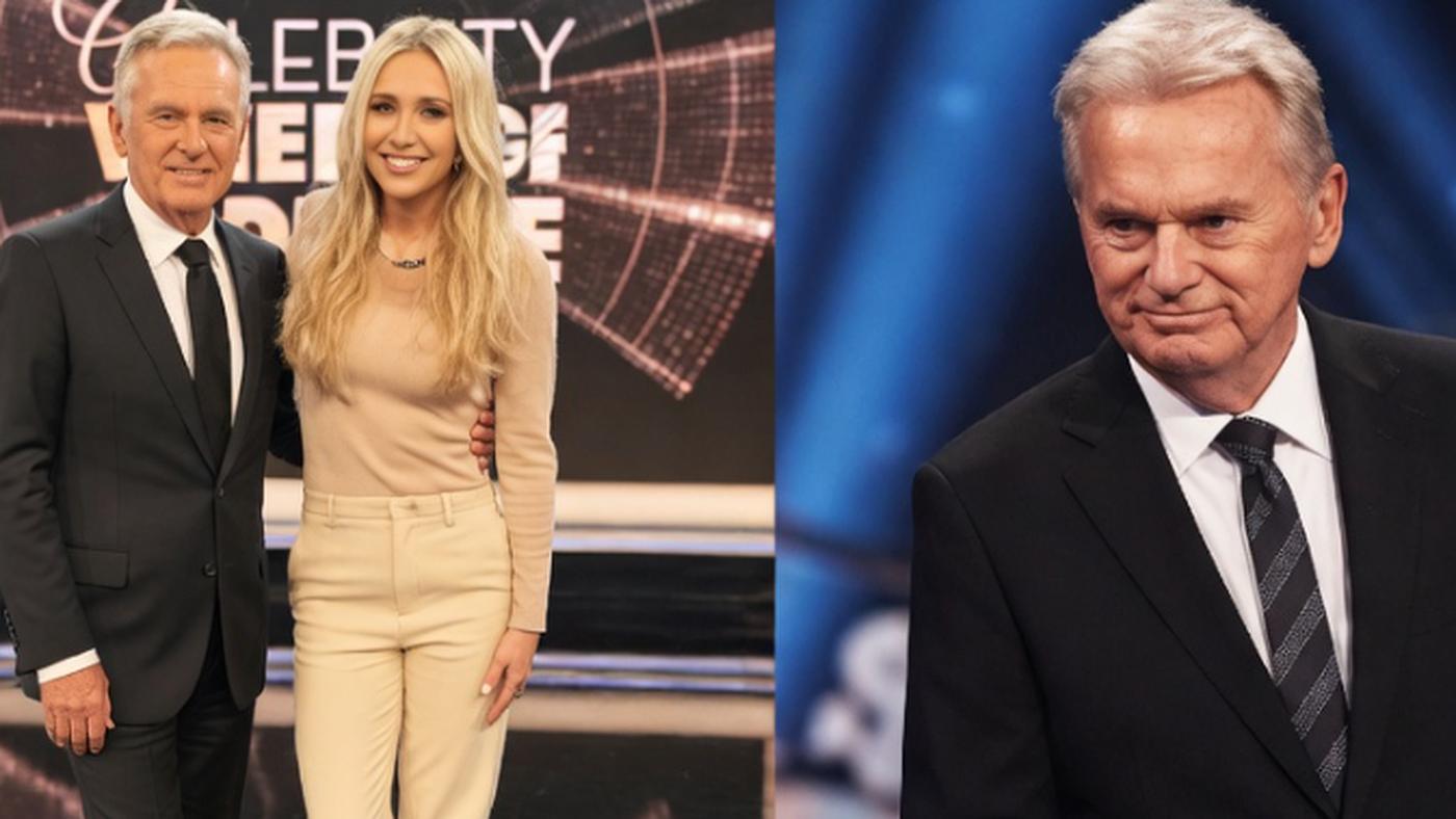 two hosts smiling together on a game show set