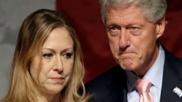 Bill Clinton with woman in formal setting