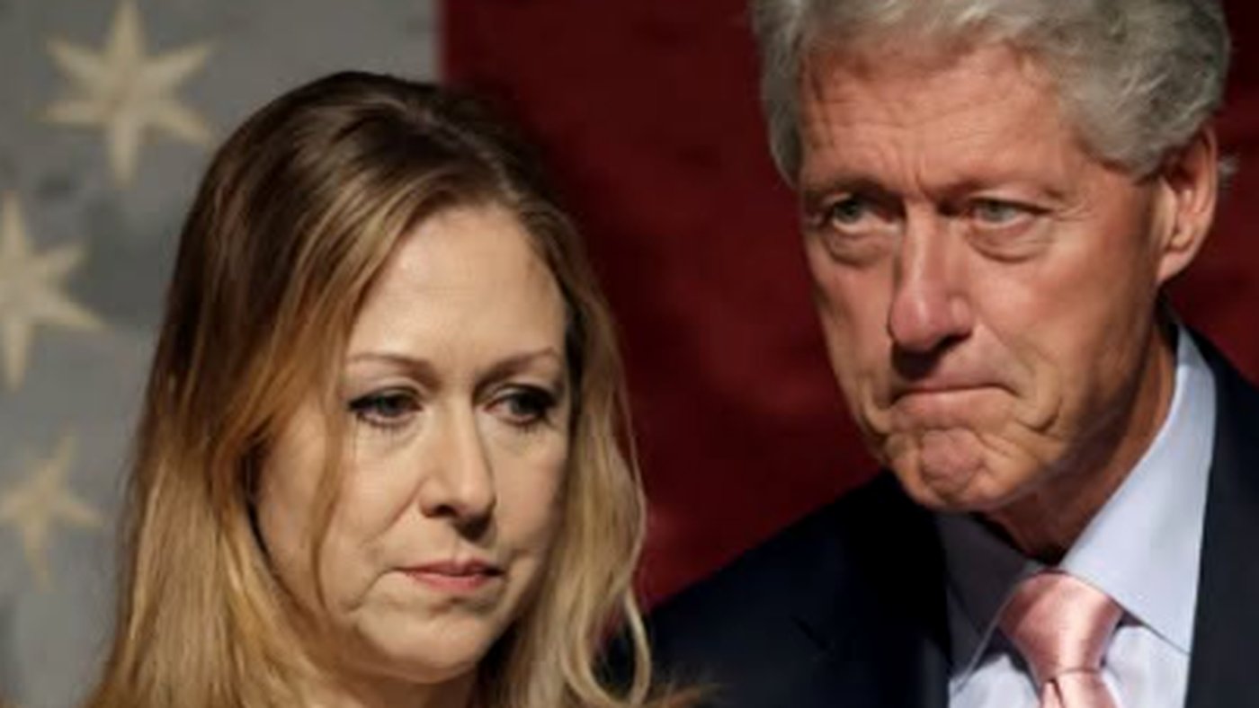 Bill Clinton with woman in formal setting