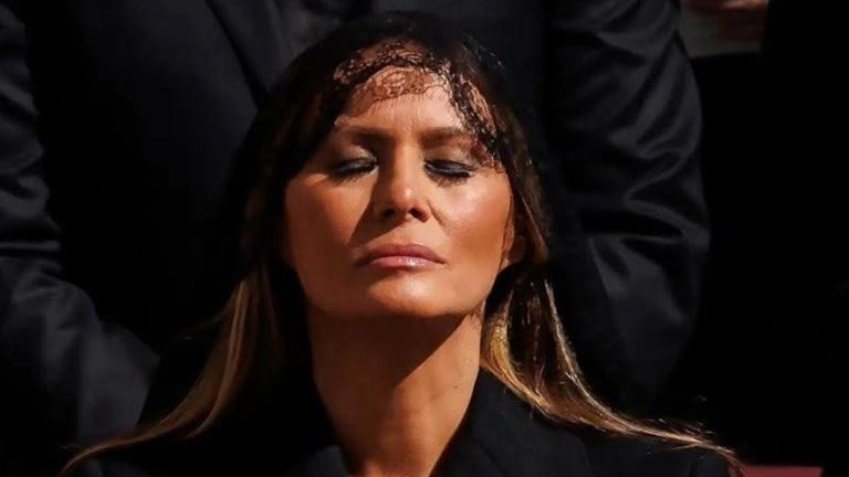 Melania Trump in black veil at solemn event