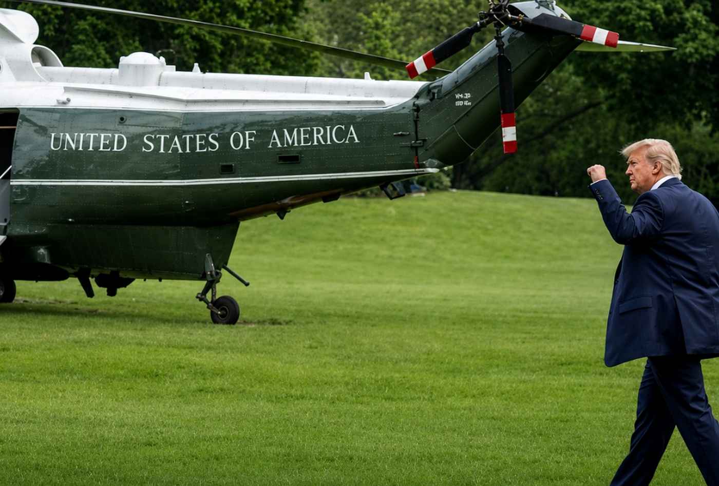 Trump walking by Marine One helicopter
