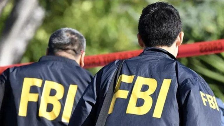 FBI agents at crime scene after kidnapper arrest