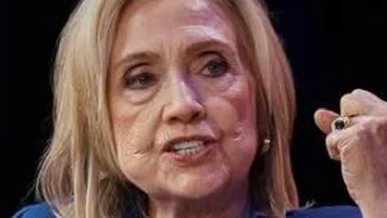 Hillary Clinton speaking with raised fist