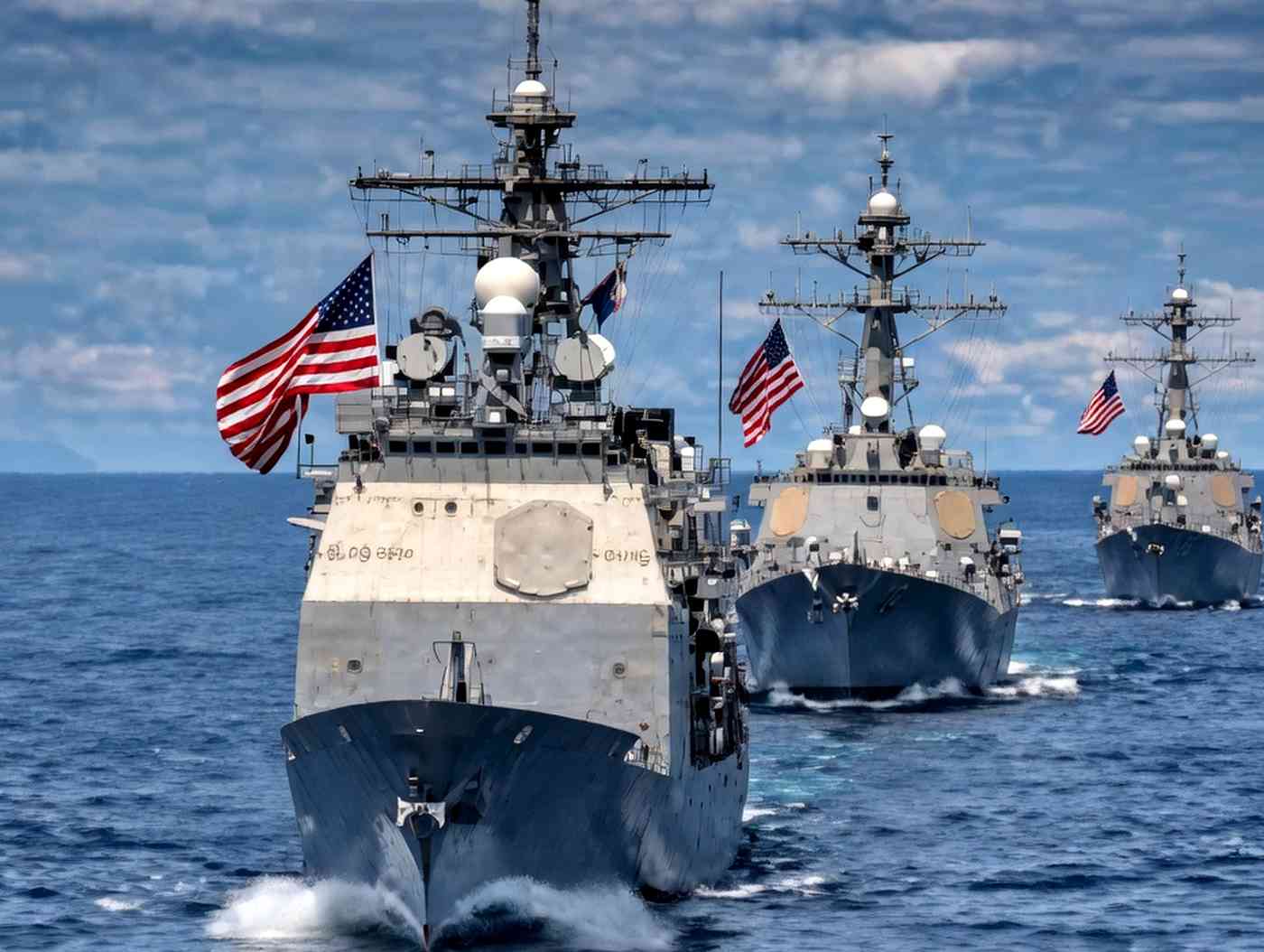 US Navy warships sailing in formation at sea
