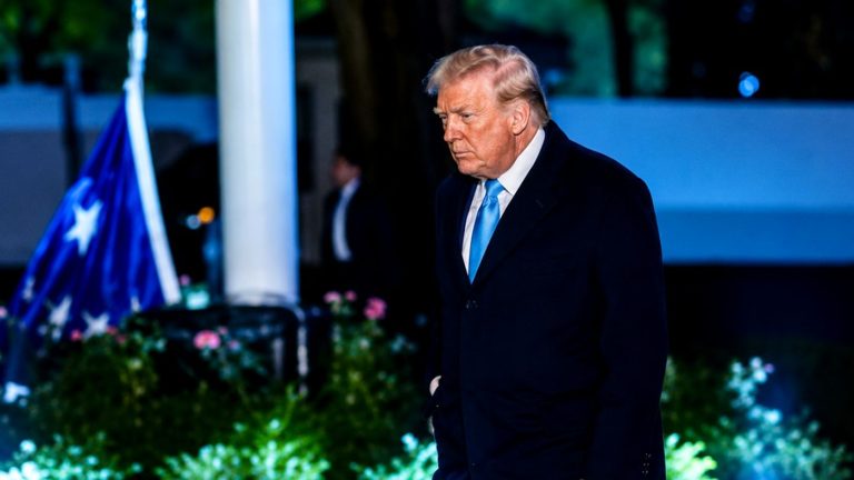 Trump walking at White House at night