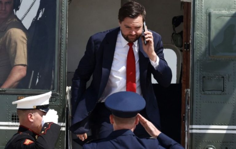 JD Vance exits helicopter saluted by Marines