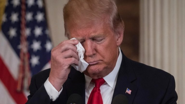 donald Trump wiping his forehead during a press conference
