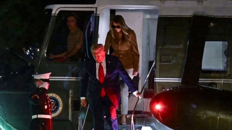 donald Trump and Melania exiting helicopter at night