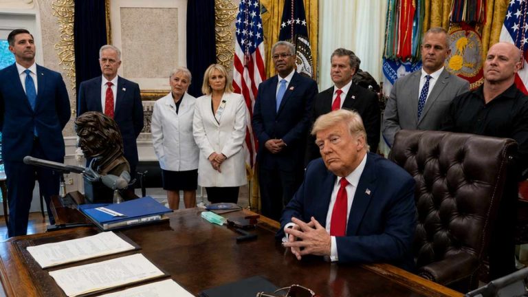 Donald Trump and officials in the Oval Office.