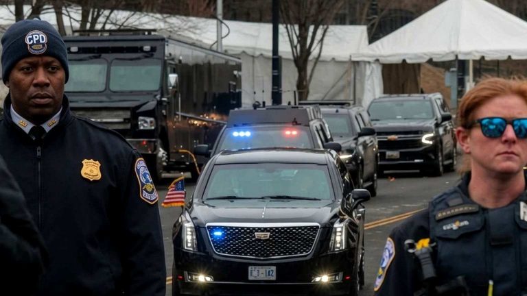 Police officers guarding presidential motorcade