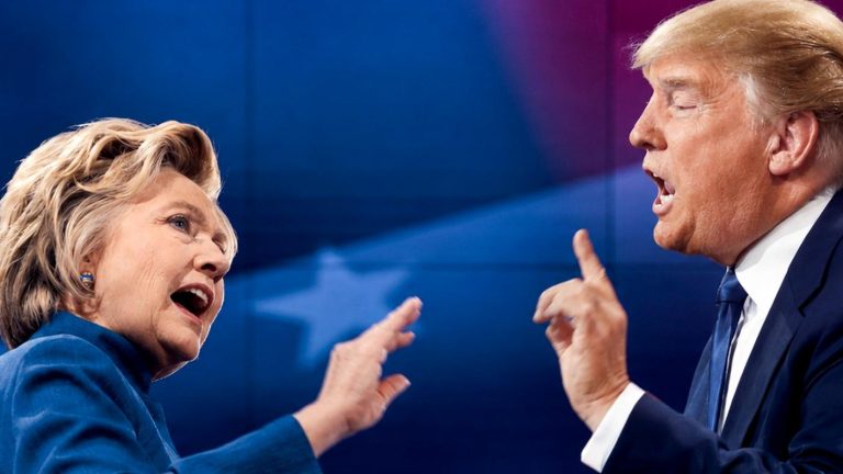 Donald Trump and Hillary Clinton debating on stage.