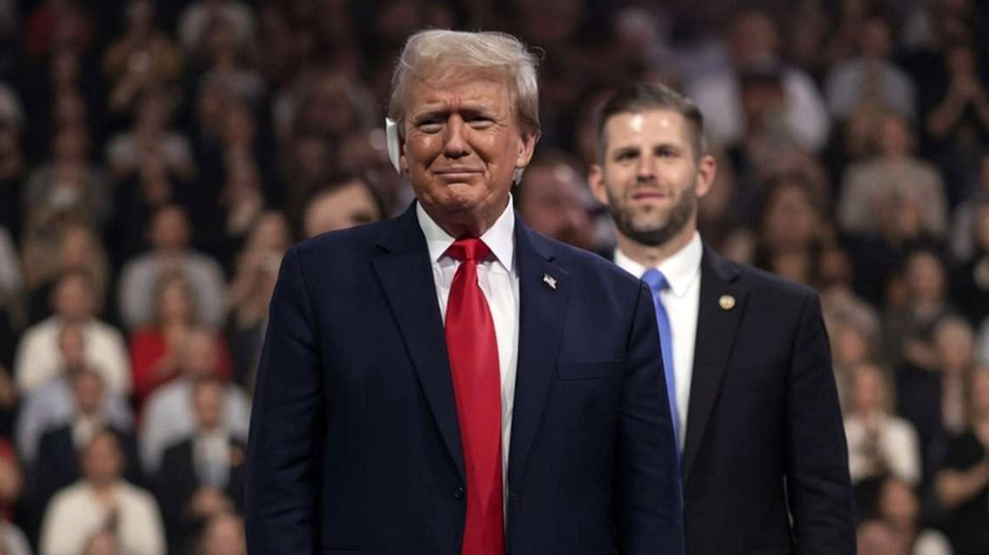 Donald Trump standing on stage at rally event