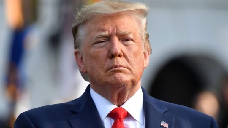 Donald Trump with hand on heart above betrayal text.