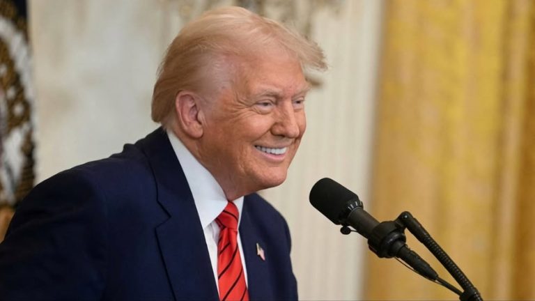 Donald Trump smiling at podium with "Trump Does It Again"