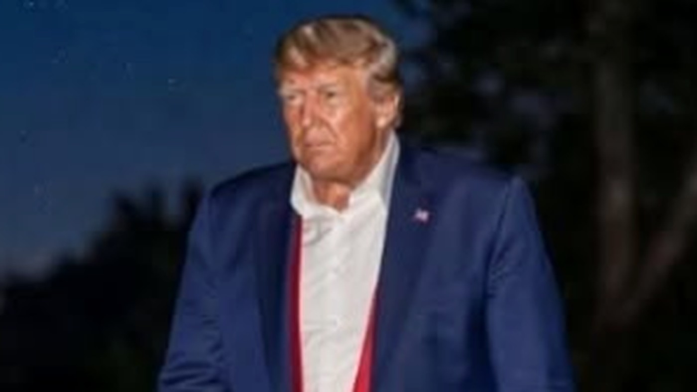 Donald Trump walking with skateboard at night