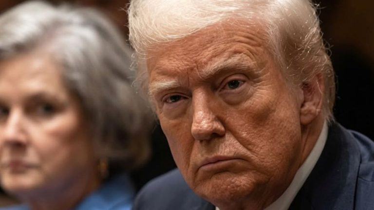 Donald Trump looking stern in a courtroom hearing.
